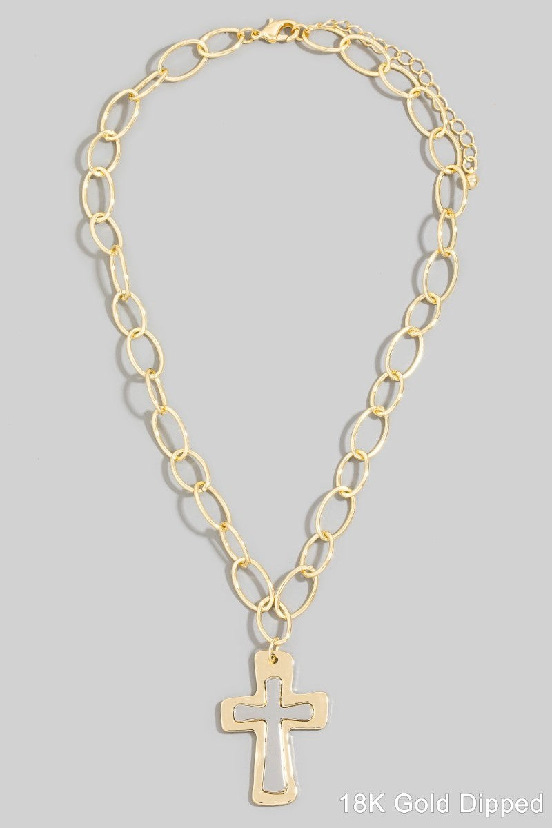 Gold chain necklace with a cross pendant on a gray background