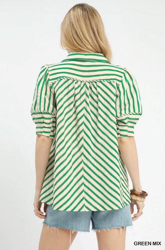 Person wearing a green and white striped shirt on a white background
