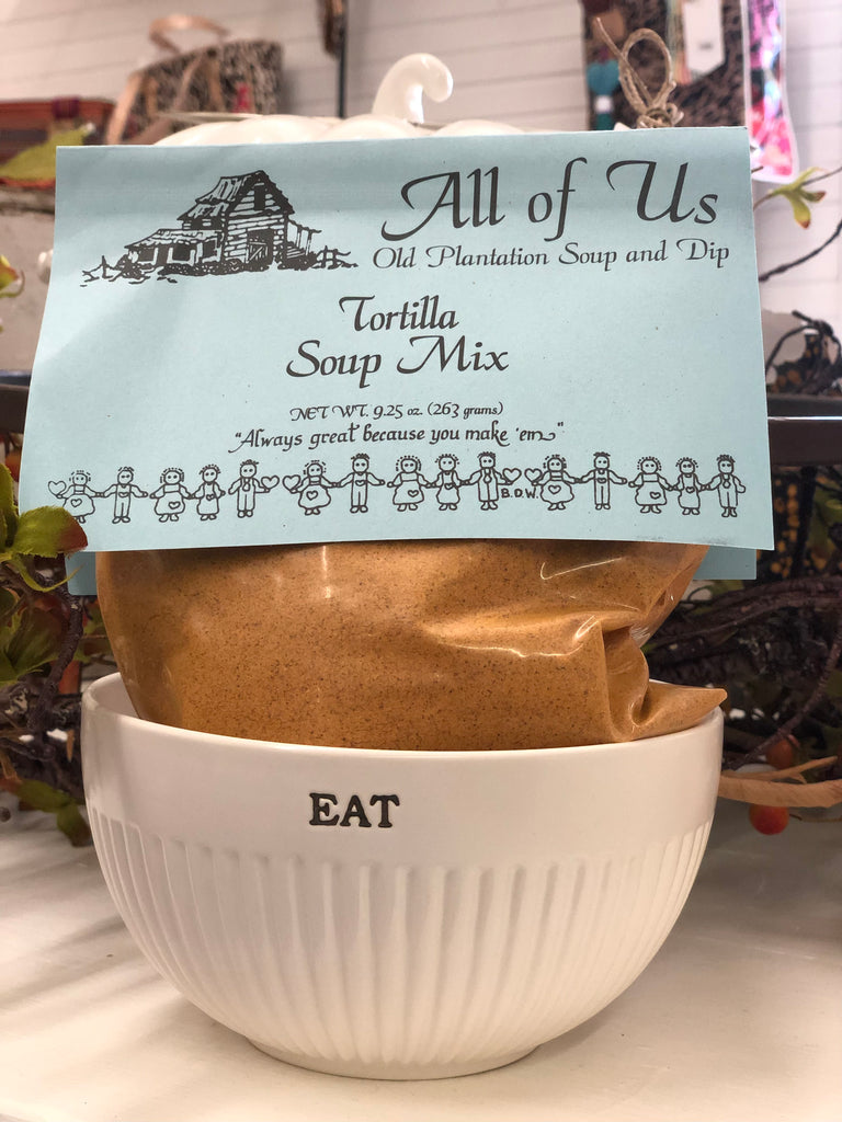 Tortilla Soup Mix package with a label on top of a white bowl labeled 'EAT'.