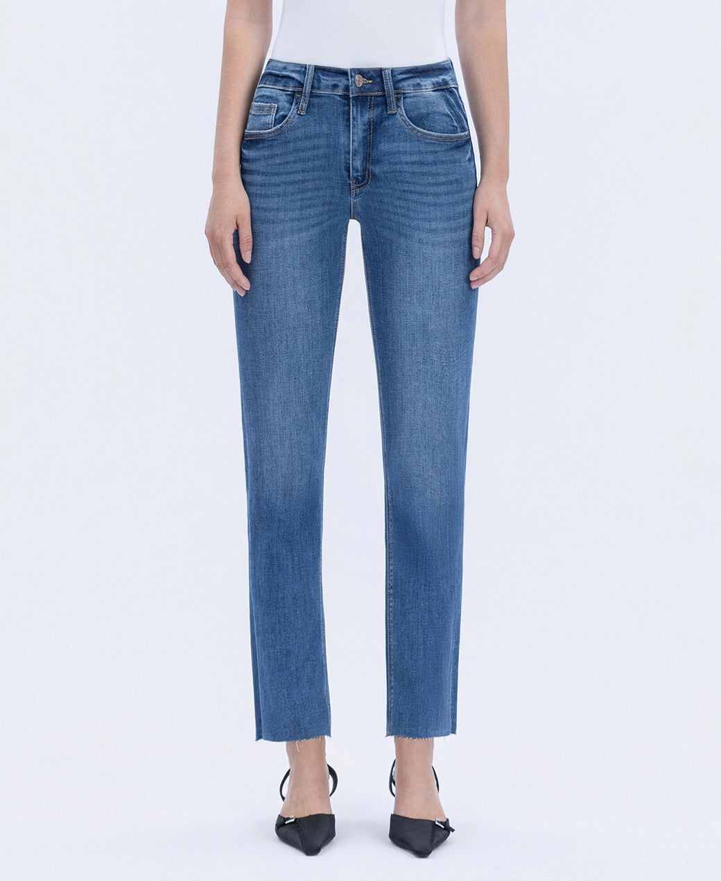 Blue jeans worn by a person on a white background