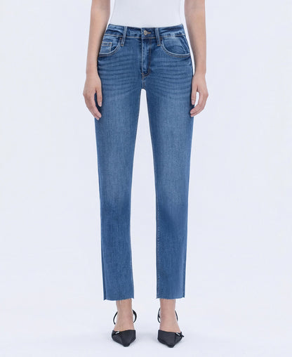 Blue jeans worn by a person on a white background
