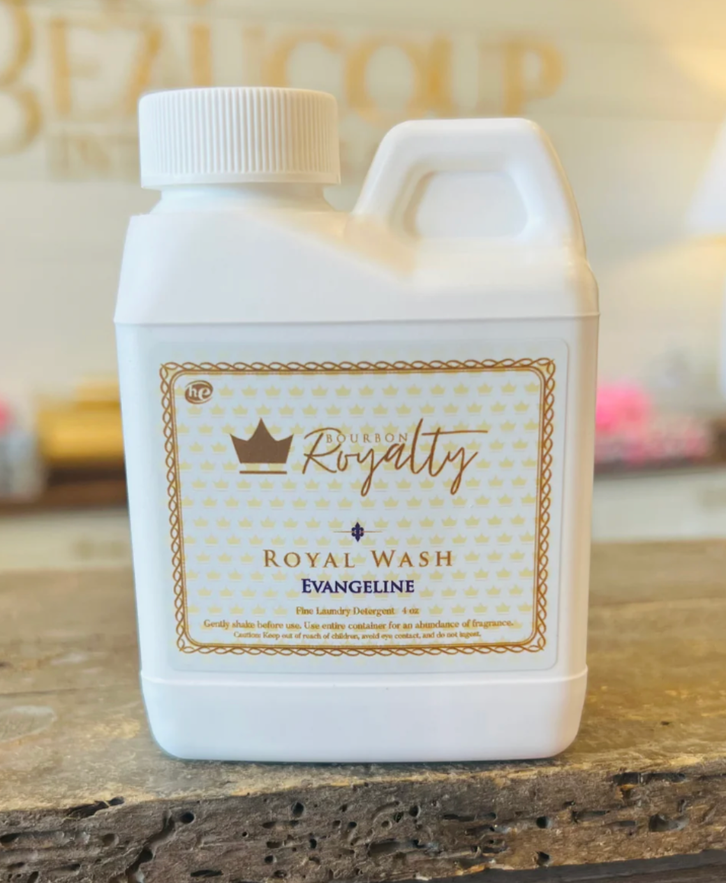 White bottle of 'Royal Wash' with gold text on a wooden surface
