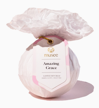 Bath bomb labeled 'Amazing Grace' by musee on a white background