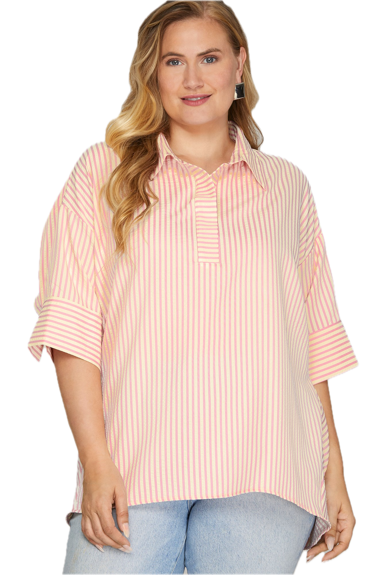 Woman wearing a pink and white striped shirt with rolled-up sleeves on a white background