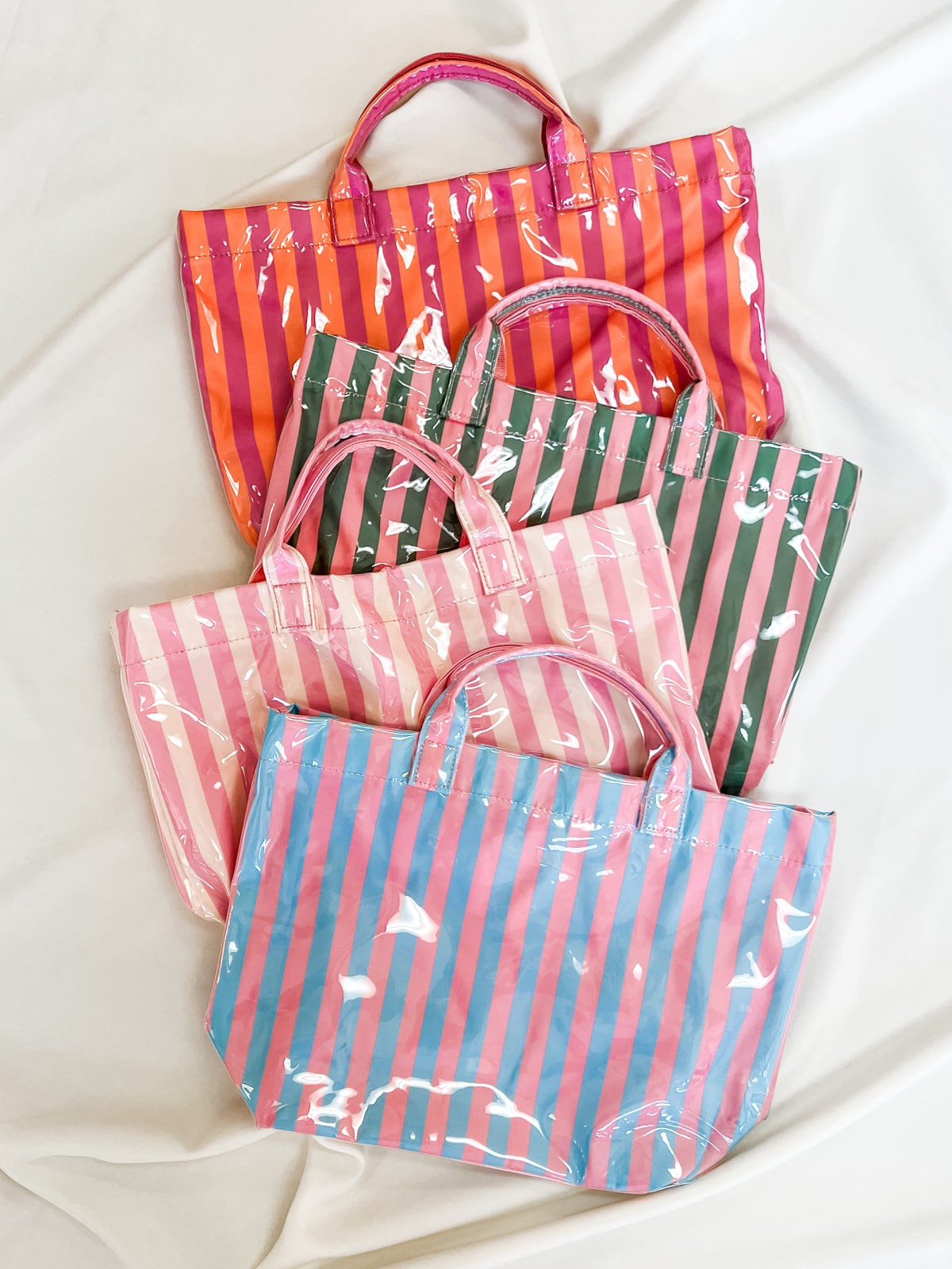Set of colorful striped bags on a white background