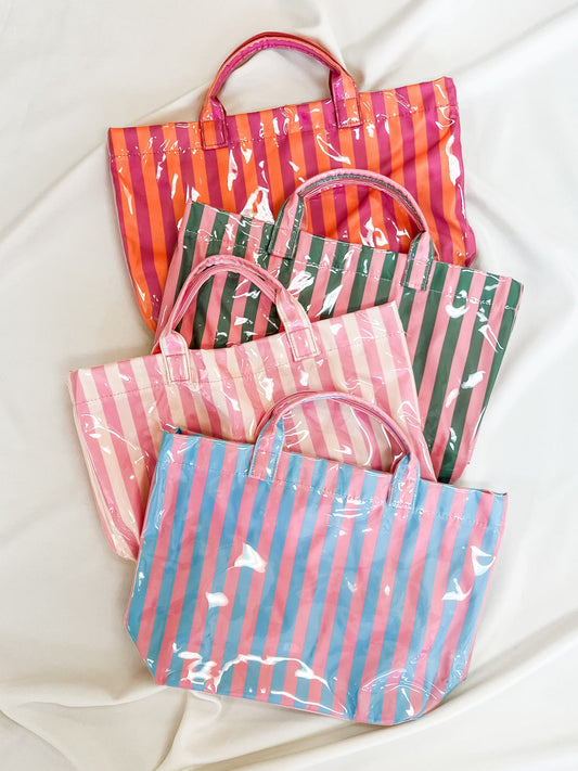 Set of colorful striped bags on a white background