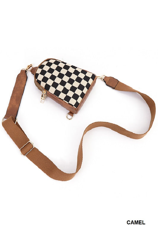 Checkered bag with a brown strap on a white background