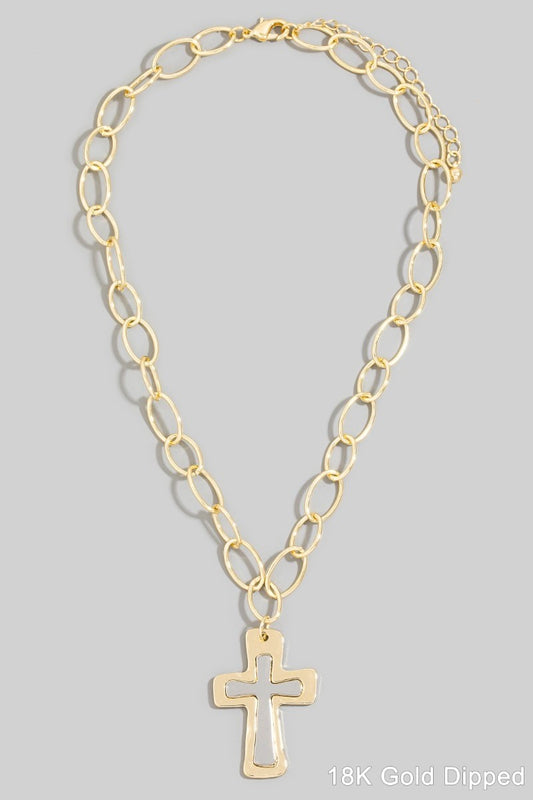 Gold chain necklace with a cross pendant on a gray background