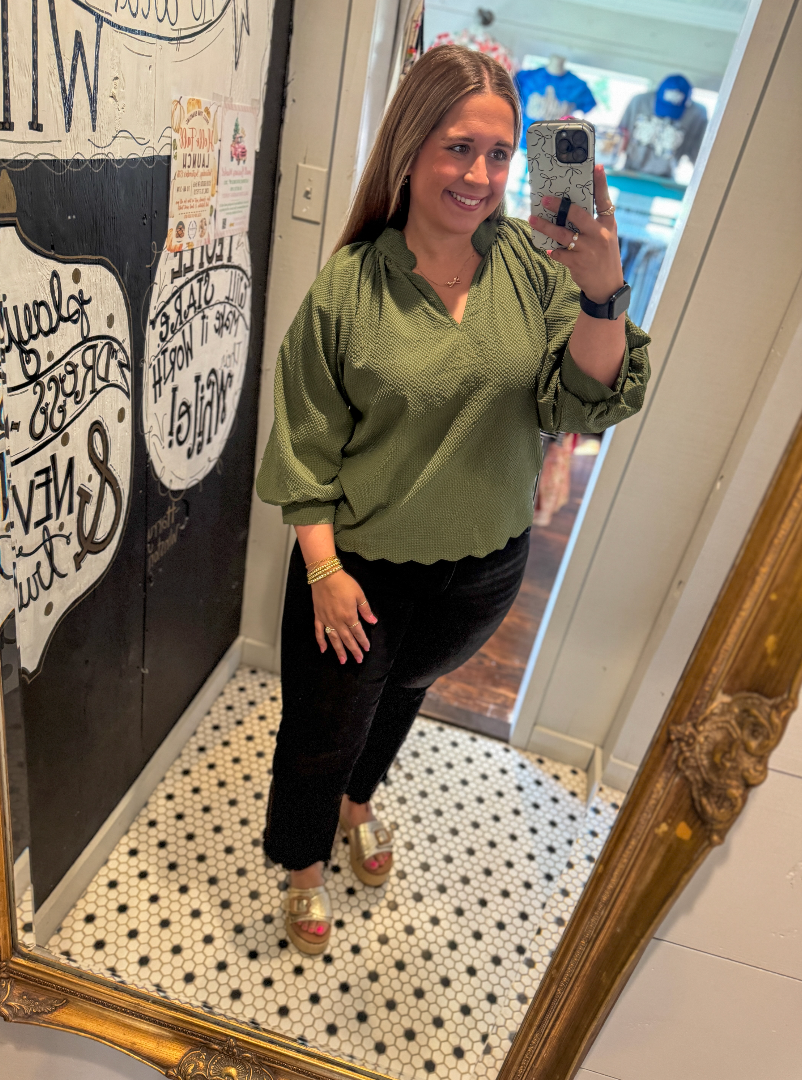 Woman wearing a green blouse