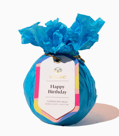 Surprise bath balm wrapped in blue tissue paper with a 'Happy Birthday' label on a white background