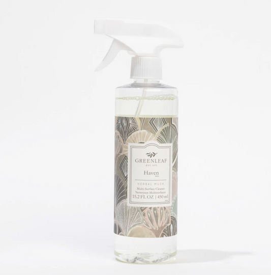 A clear plastic spray bottle of Greenleaf London Haven herbal rinse with a white trigger sprayer and a botanical-patterned label, set against a plain white background.