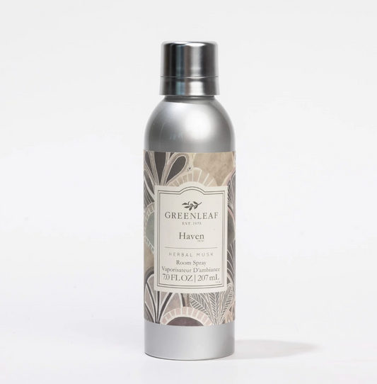 A silver aluminum spray bottle of Greenleaf Herbals 'Haven' Herbal Musk Room Spray, featuring a botanical pattern label and a metallic silver cap, set against a plain white background.
