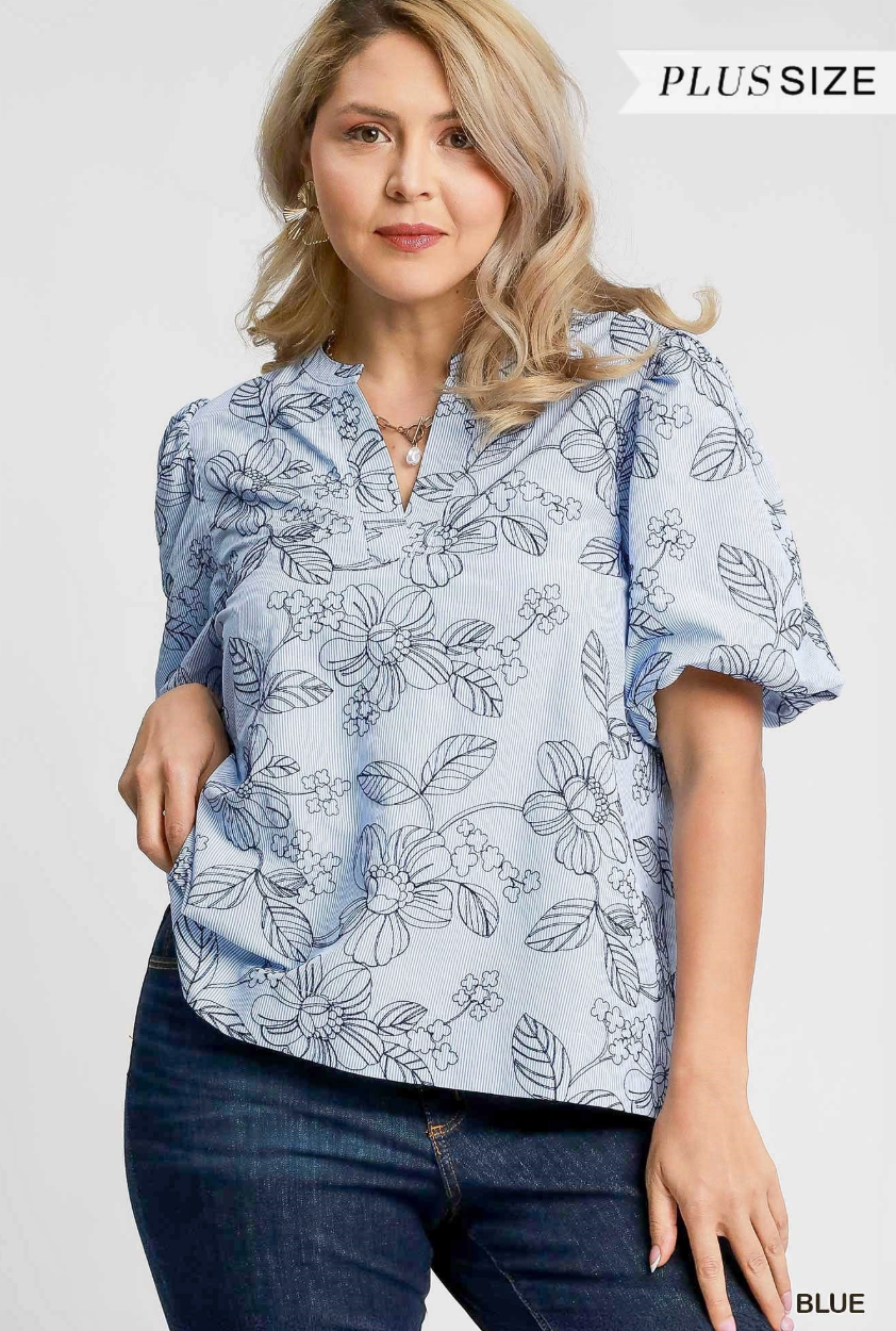 Woman wearing a blue floral blouse with text 'Plus Size' and 'Blue' on a white background