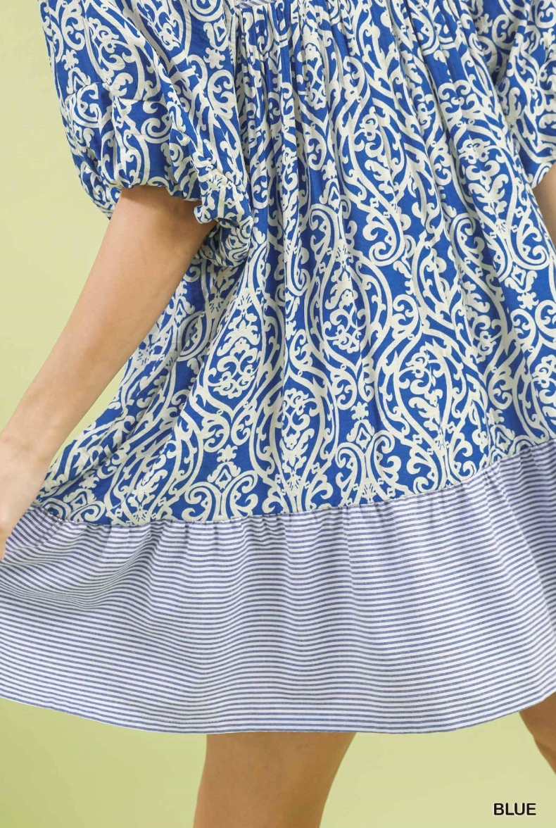 Blue and white patterned dress on a yellow background