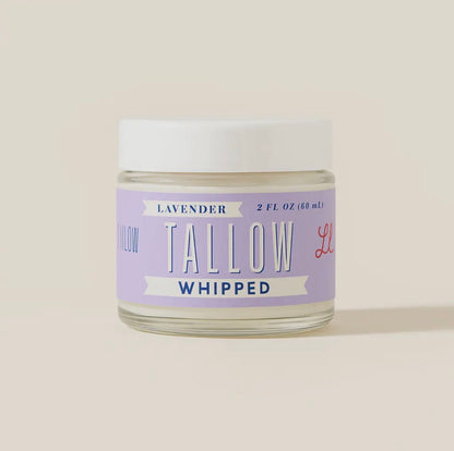 Jar of lavender tallow whipped product on a light beige background