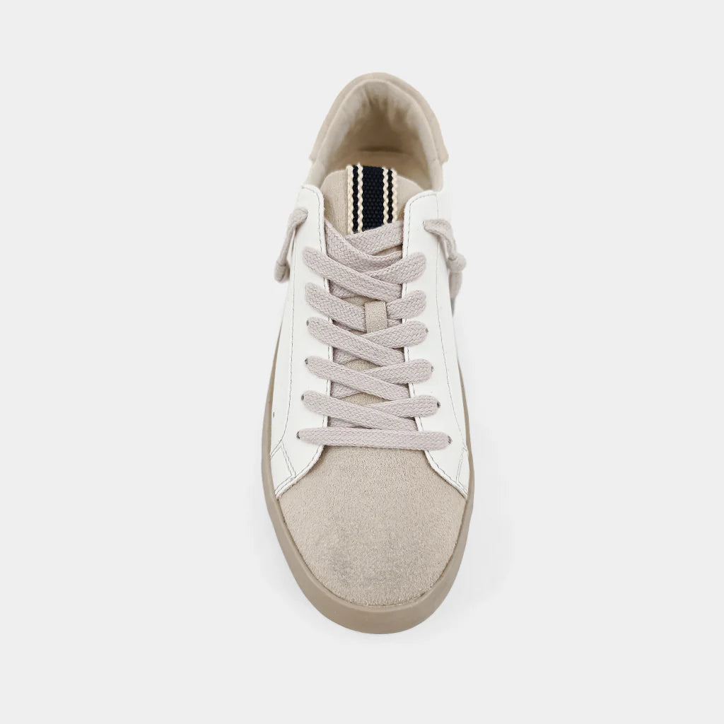 White sneaker with beige sole on a white background