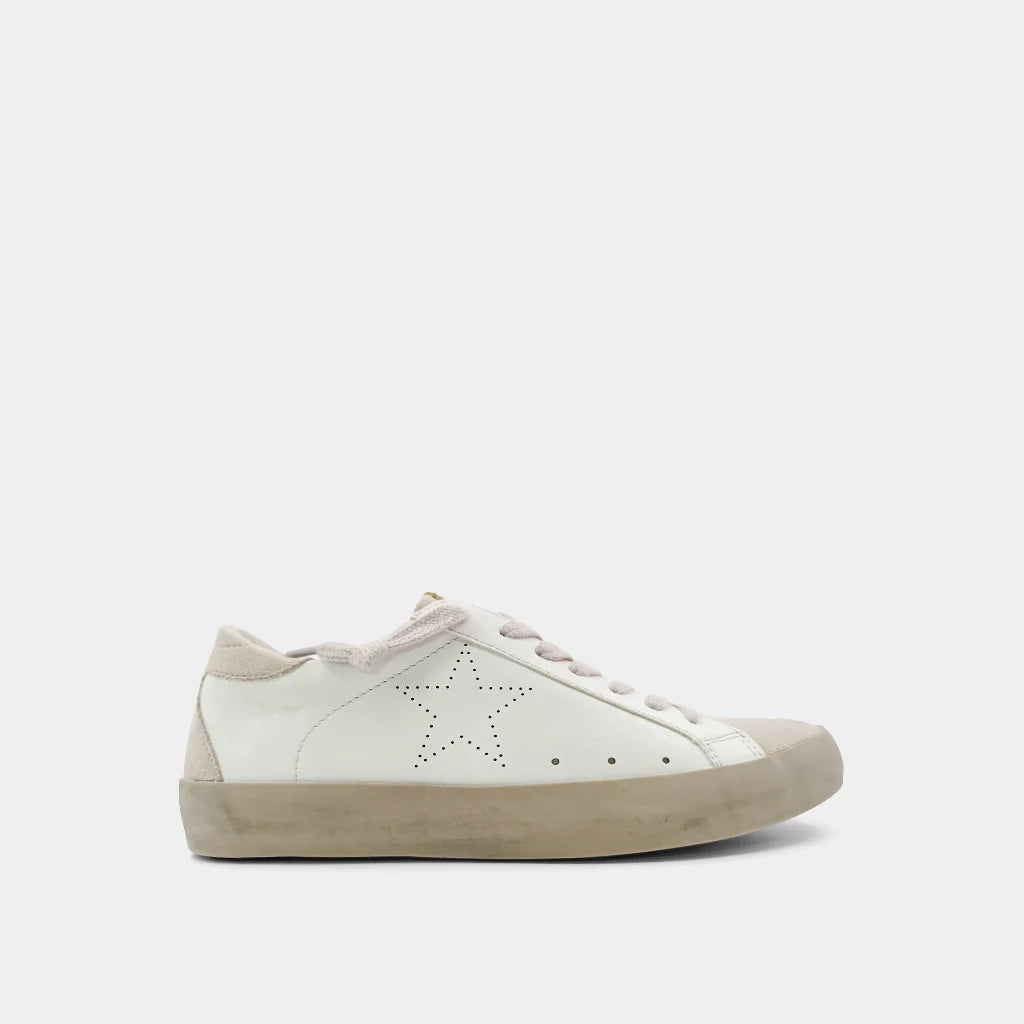 White sneaker with beige sole on a white background