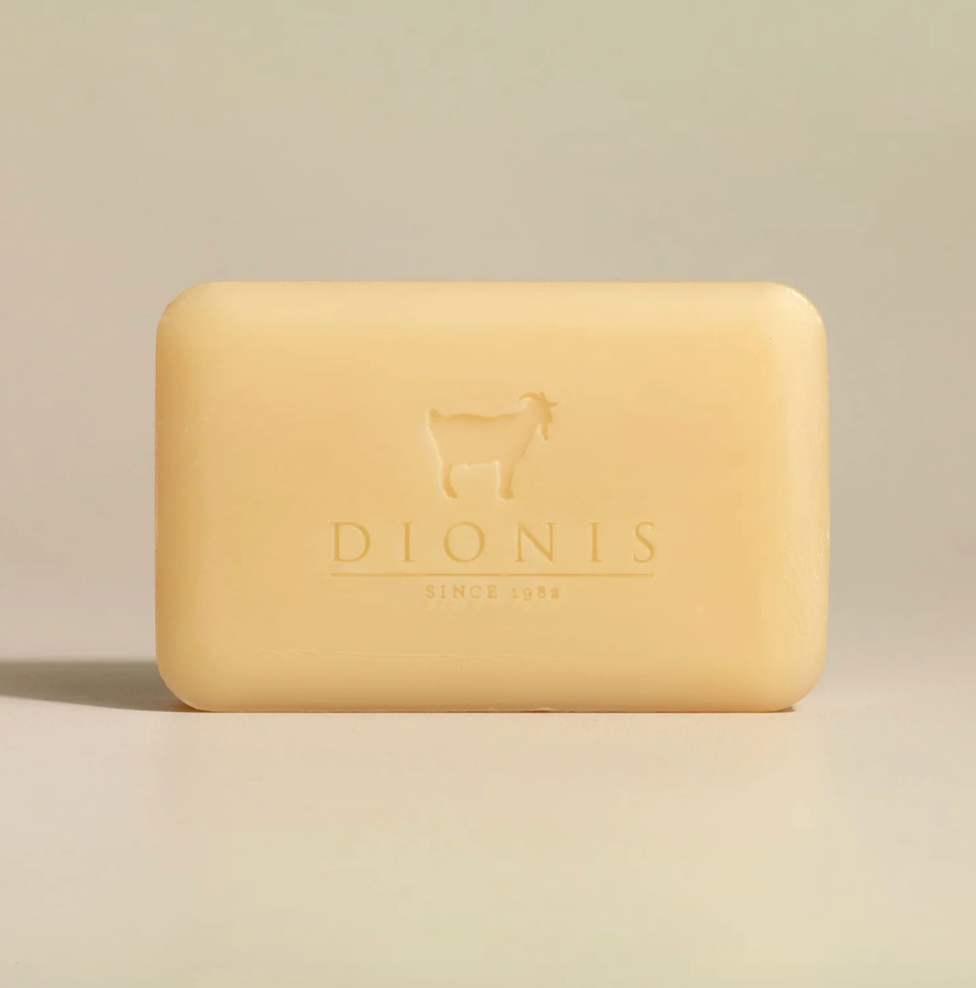 Beige bar of soap with 'Dionis' branding on a beige background