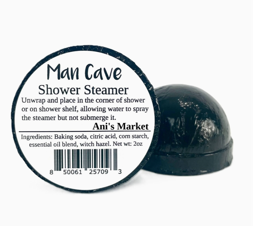 Man Cave Shower Steamer with label and black steamer on white background