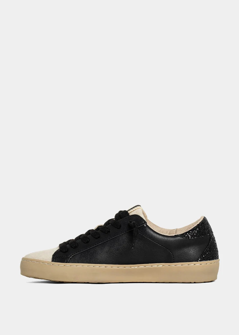 Black and beige sneaker on a white background
