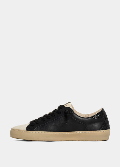 Black and beige sneaker on a white background