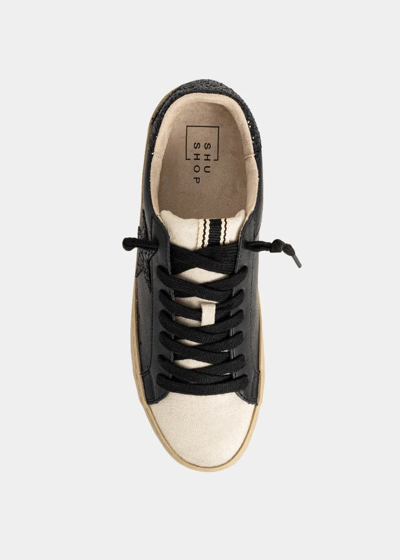 Black and white sneaker on a light gray background