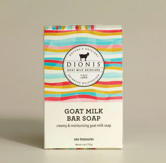 Dionis goat milk bar soap packaging with colorful striped design on a beige background