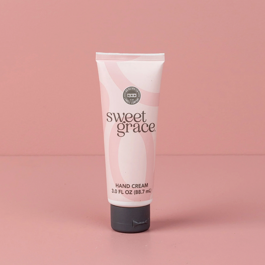 Tube of sweet grace hand cream on a pink background
