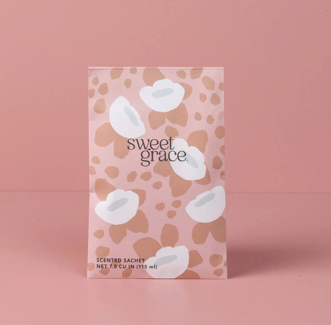 Scented sachet packaging with 'sweet grace' branding on a pink background