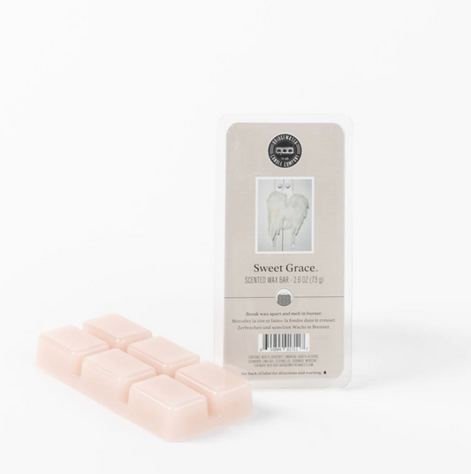 Packaged wax bars with a label on a white background
