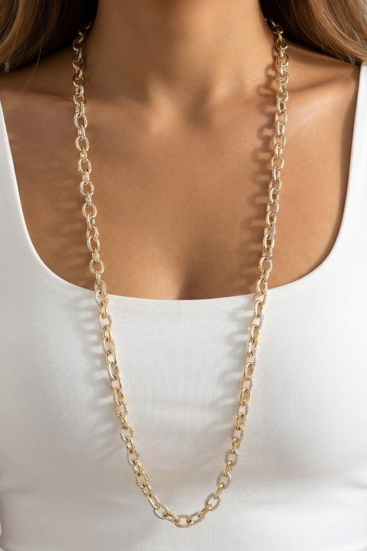 Mix Metal chain necklace worn by a person on a white background