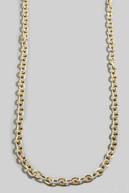 Mix Metal chain necklace on a gray background