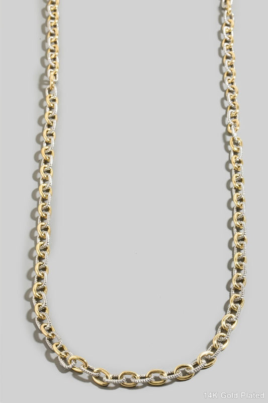 Mix Metal chain necklace on a gray background