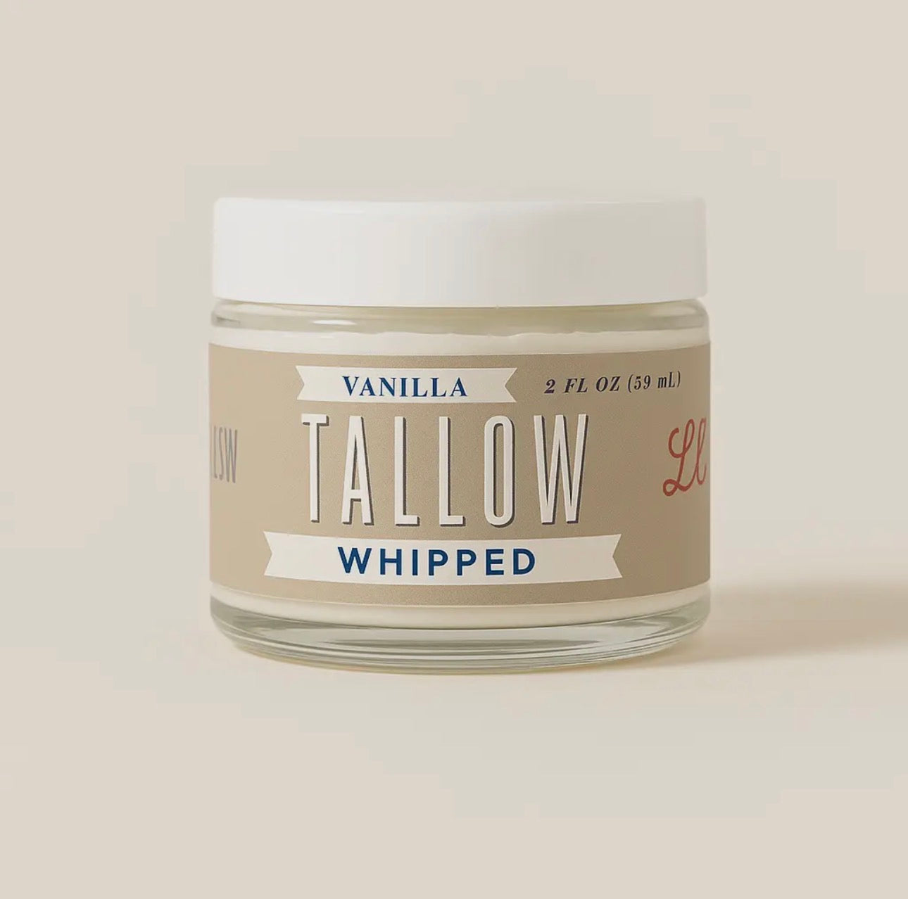 Jar of vanilla whipped tallow on a white background